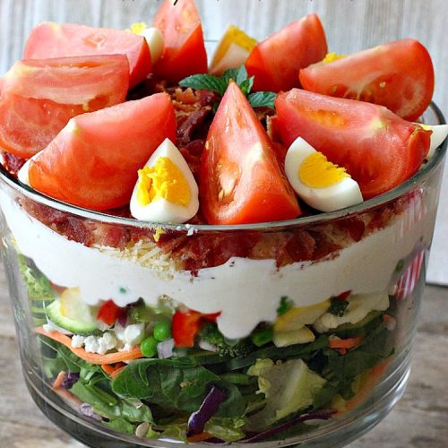 24-Hour Layered Salad | Can't Stay Out of the Kitchen | Wow, I absolutely love this stuff! This #salad has so many layers & tastes absolutely awesome. We love to serve it for potlucks, backyard #BBQs and summer #holidays like #FathersDay, #FourthofJuly & #LaborDay. #bacon #romano #glutenfree