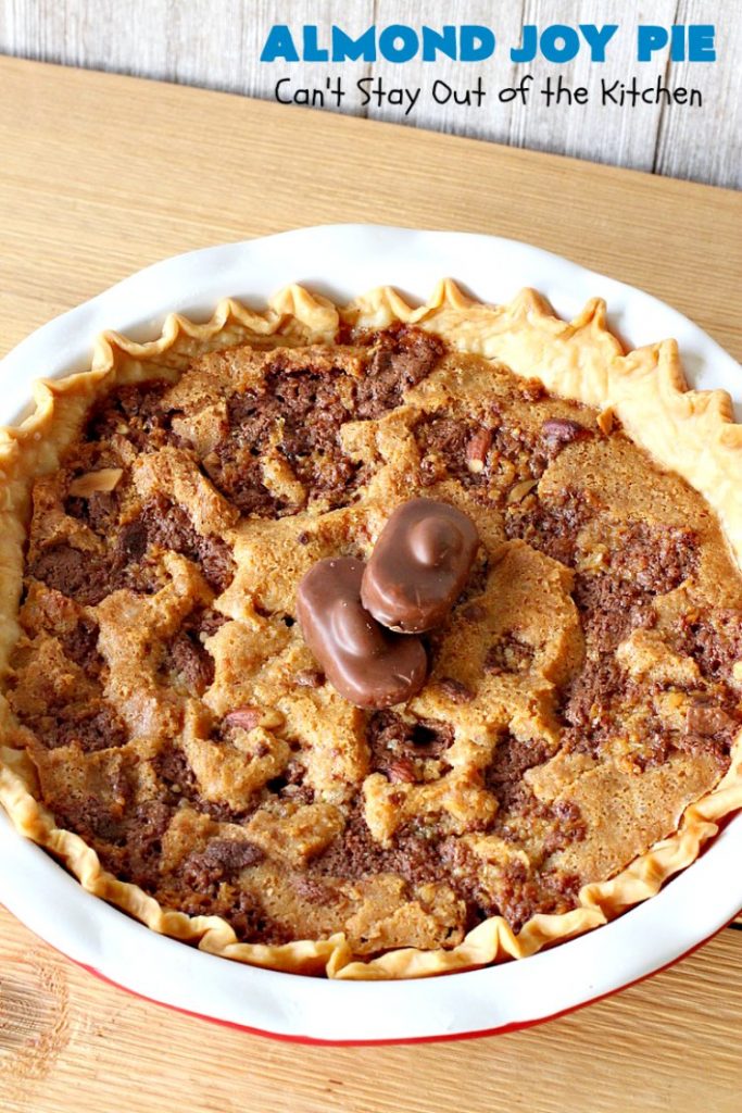 Almond Joy Pie | Can't Stay Out of the Kitchen | this fantastic #pie is filled with #AlmondJoyBars. So it's loaded with #chocolate, #coconut & #almonds. Every bite is breathtaking. Great #dessert for company or #holidays like #ValentinesDay. #HolidayDessert #ValentinesDayDessert #AlmondJoyDessert #AlmondJoyPie #ChocolateDessert #CoconutDessert #AlmondDessert