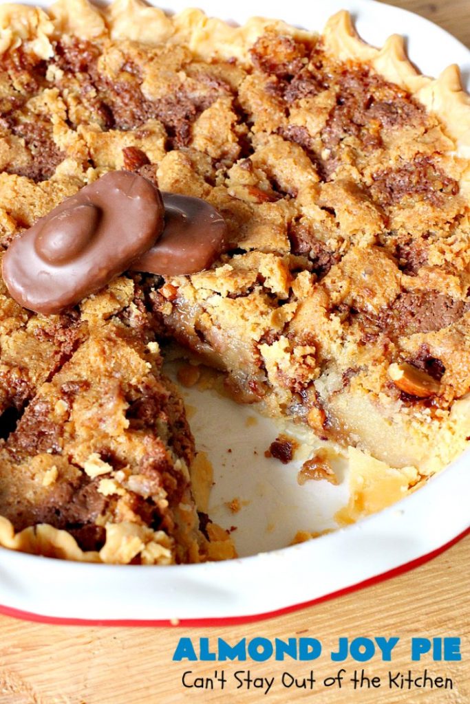 Almond Joy Pie | Can't Stay Out of the Kitchen | this fantastic #pie is filled with #AlmondJoyBars. So it's loaded with #chocolate, #coconut & #almonds. Every bite is breathtaking. Great #dessert for company or #holidays like #ValentinesDay. #HolidayDessert #ValentinesDayDessert #AlmondJoyDessert #AlmondJoyPie #ChocolateDessert #CoconutDessert #AlmondDessert