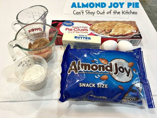 Almond Joy Pie | Can't Stay Out of the Kitchen | this fantastic #pie is filled with #AlmondJoyBars. So it's loaded with #chocolate, #coconut & #almonds. Every bite is breathtaking. Great #dessert for company or #holidays like #ValentinesDay. #HolidayDessert #ValentinesDayDessert #AlmondJoyDessert #AlmondJoyPie #ChocolateDessert #CoconutDessert #AlmondDessert