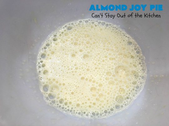 Almond Joy Pie | Can't Stay Out of the Kitchen | this fantastic #pie is filled with #AlmondJoyBars. So it's loaded with #chocolate, #coconut & #almonds. Every bite is breathtaking. Great #dessert for company or #holidays like #ValentinesDay. #HolidayDessert #ValentinesDayDessert #AlmondJoyDessert #AlmondJoyPie #ChocolateDessert #CoconutDessert #AlmondDessert
