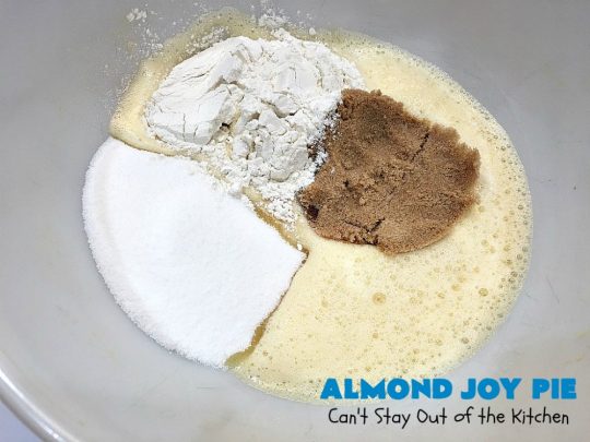 Almond Joy Pie | Can't Stay Out of the Kitchen | this fantastic #pie is filled with #AlmondJoyBars. So it's loaded with #chocolate, #coconut & #almonds. Every bite is breathtaking. Great #dessert for company or #holidays like #ValentinesDay. #HolidayDessert #ValentinesDayDessert #AlmondJoyDessert #AlmondJoyPie #ChocolateDessert #CoconutDessert #AlmondDessert