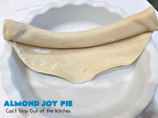 Almond Joy Pie | Can't Stay Out of the Kitchen | this fantastic #pie is filled with #AlmondJoyBars. So it's loaded with #chocolate, #coconut & #almonds. Every bite is breathtaking. Great #dessert for company or #holidays like #ValentinesDay. #HolidayDessert #ValentinesDayDessert #AlmondJoyDessert #AlmondJoyPie #ChocolateDessert #CoconutDessert #AlmondDessert