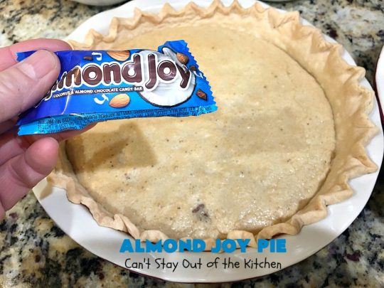 Almond Joy Pie | Can't Stay Out of the Kitchen | this fantastic #pie is filled with #AlmondJoyBars. So it's loaded with #chocolate, #coconut & #almonds. Every bite is breathtaking. Great #dessert for company or #holidays like #ValentinesDay. #HolidayDessert #ValentinesDayDessert #AlmondJoyDessert #AlmondJoyPie #ChocolateDessert #CoconutDessert #AlmondDessert
