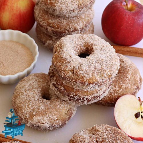 Apple Cinnamon Donuts | Can't Stay Out of the Kitchen | Brighten up your day with a batch of these fantastic #donuts. #AppleCinnamonDonuts include both #applesauce & #apples & they're rolled in melted butter and dredged in a #cinnamon-sugar mixture. Terrific for a weekend, company or #holiday #breakfast. You'll be swooning from the first bite! #HolidayBreakfast