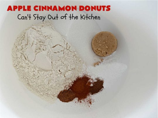 Apple Cinnamon Donuts | Can't Stay Out of the Kitchen | Brighten up your day with a batch of these fantastic #donuts. #AppleCinnamonDonuts include both #applesauce & #apples & they're rolled in melted butter and dredged in a #cinnamon-sugar mixture. Terrific for a weekend, company or #holiday #breakfast. You'll be swooning from the first bite! #HolidayBreakfast