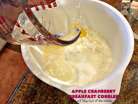 Apple Cranberry Breakfast Cobbler | this amazing #recipe is half #cobbler and half #CoffeeCake. It's made with a can of #AppleCranberryPieFilling & tastes absolutely scrumptious. It's great for a #holiday #breakfast like #Thanksgiving or #Christmas. Every bite will have you drooling! #AppleCranberryBreakfastCobbler #BreakfastCobbler #HolidayBreakfast
