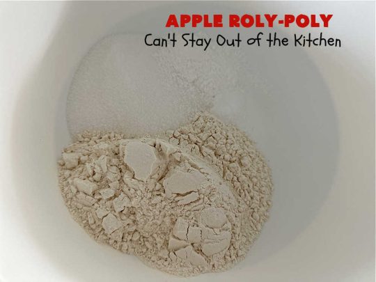 Apply Roly-Poly | Can't Stay Out of the Kitchen | #AppleRolyPoly is one of the best #desserts you'll ever sink your teeth into. This #cobbler-type #dessert rolls up like #PieCrust & is sliced into #pinwheels. It has a #cinnamon #syrup poured over top before #baking. The result has a #cake-like texture & is beyond spectacular. Excellent served with #IceCream. #apples #AppleDessert #AppleCobbler