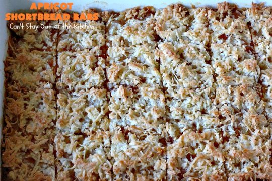 Apricot Shortbread Bars | these luscious #cookies have a #shortbread crust, spread with #Apricot jelly & topped with a scrumptious #coconut topping. Terrific for #tailgating parties, potlucks or #ChristmasCookieExchanges. #dessert #ApricotDessert #HolidayDessert #ApricotShortbreadBars
