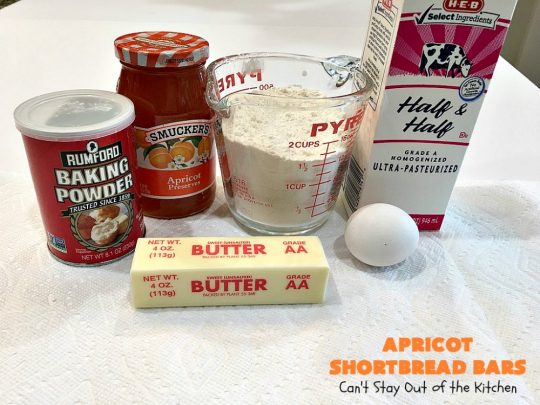 Apricot Shortbread Bars | these luscious #cookies have a #shortbread crust, spread with #Apricot jelly & topped with a scrumptious #coconut topping. Terrific for #tailgating parties, potlucks or #ChristmasCookieExchanges. #dessert #ApricotDessert #HolidayDessert #ApricotShortbreadBars