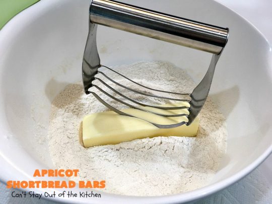 Apricot Shortbread Bars | these luscious #cookies have a #shortbread crust, spread with #Apricot jelly & topped with a scrumptious #coconut topping. Terrific for #tailgating parties, potlucks or #ChristmasCookieExchanges. #dessert #ApricotDessert #HolidayDessert #ApricotShortbreadBars