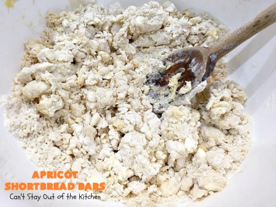 Apricot Shortbread Bars | these luscious #cookies have a #shortbread crust, spread with #Apricot jelly & topped with a scrumptious #coconut topping. Terrific for #tailgating parties, potlucks or #ChristmasCookieExchanges. #dessert #ApricotDessert #HolidayDessert #ApricotShortbreadBars