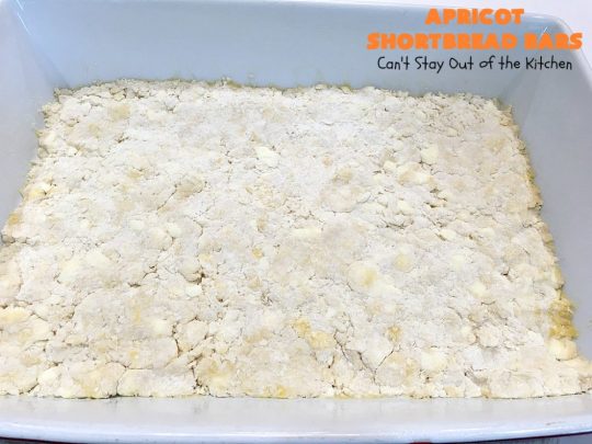 Apricot Shortbread Bars | these luscious #cookies have a #shortbread crust, spread with #Apricot jelly & topped with a scrumptious #coconut topping. Terrific for #tailgating parties, potlucks or #ChristmasCookieExchanges. #dessert #ApricotDessert #HolidayDessert #ApricotShortbreadBars
