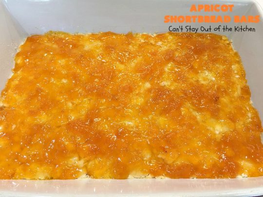 Apricot Shortbread Bars | these luscious #cookies have a #shortbread crust, spread with #Apricot jelly & topped with a scrumptious #coconut topping. Terrific for #tailgating parties, potlucks or #ChristmasCookieExchanges. #dessert #ApricotDessert #HolidayDessert #ApricotShortbreadBars