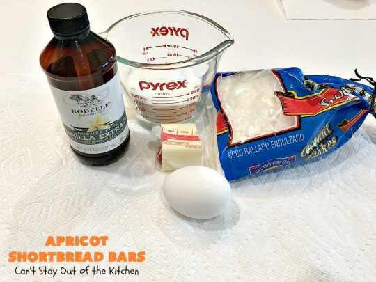 Apricot Shortbread Bars | these luscious #cookies have a #shortbread crust, spread with #Apricot jelly & topped with a scrumptious #coconut topping. Terrific for #tailgating parties, potlucks or #ChristmasCookieExchanges. #dessert #ApricotDessert #HolidayDessert #ApricotShortbreadBars