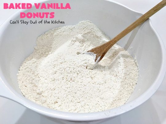 Baked Vanilla Donuts | Can't Stay Out of the Kitchen | Wow your #Thanksgiving or #Christmas #breakfast guests with these spectacular homemade #donuts. They are glazed 3 times in vanilla icing before adding #sprinkles. I made them a day in advance & they were still heavenly. #holiday #holidaybreakfast #ThanksgivingBreakfast #BakedDonuts #ChristmasBreakfast #vanilladonuts