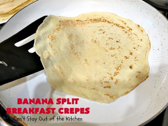 Banana Split Breakfast Crêpes | Can't Stay Out of the Kitchen | these spectacular #breakfast #crêpes will rock your world! They're filling with a #pineapple filling & sliced #bananas. Then garnished with #walnuts, bananas #MaraschinoCherries & whipped cream. Perfect for a company or #holiday breakfast. #BreakfastCrêpes #BananaSplit #BananaSplitBreakfastCrêpes