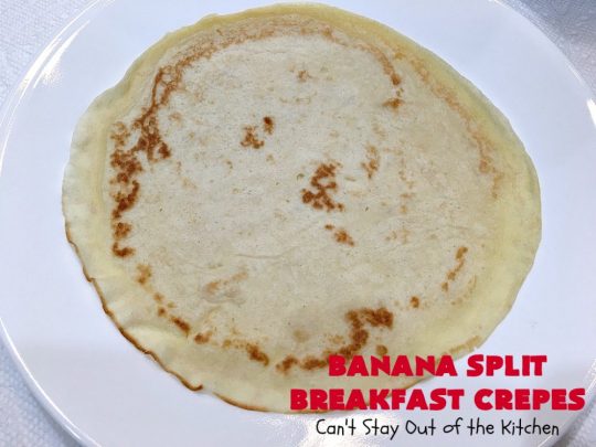 Banana Split Breakfast Crêpes | Can't Stay Out of the Kitchen | these spectacular #breakfast #crêpes will rock your world! They're filling with a #pineapple filling & sliced #bananas. Then garnished with #walnuts, bananas #MaraschinoCherries & whipped cream. Perfect for a company or #holiday breakfast. #BreakfastCrêpes #BananaSplit #BananaSplitBreakfastCrêpes