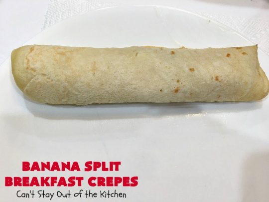 Banana Split Breakfast Crêpes | Can't Stay Out of the Kitchen | these spectacular #breakfast #crêpes will rock your world! They're filling with a #pineapple filling & sliced #bananas. Then garnished with #walnuts, bananas #MaraschinoCherries & whipped cream. Perfect for a company or #holiday breakfast. #BreakfastCrêpes #BananaSplit #BananaSplitBreakfastCrêpes