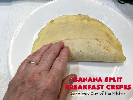 Banana Split Breakfast Crêpes | Can't Stay Out of the Kitchen | these spectacular #breakfast #crêpes will rock your world! They're filling with a #pineapple filling & sliced #bananas. Then garnished with #walnuts, bananas #MaraschinoCherries & whipped cream. Perfect for a company or #holiday breakfast. #BreakfastCrêpes #BananaSplit #BananaSplitBreakfastCrêpes