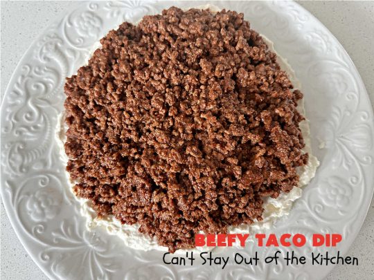 Beefy Taco Dip | Can't Stay Out of the Kitchen | #BeefyTacoDip is a sensational #TexMex #appetizer. This is a #LayeredDip with a #CreamCheese layer, a #GroundBeef layer with #TacoSeasoning & then it's topped with #lettuce, #tomatoes, #GreenOnions & #BellPeppers. Serve with #Fritos or #TortillaChips. Great for #tailgating parties, backyard barbecues or potlucks. #GlutenFree