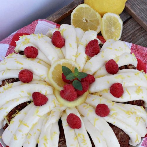 Best Lemon Bundt Cake | Can't Stay Out of the Kitchen | this fantastic #cake is better than #NothingBundtCakes! It uses a #lemon cake mix, lemon jell-O, vanilla pudding mix & #LemonPieFilling. Then it's topped with a scrumptious #CreamCheese icing that's out of this world. If you enjoy lemony #desserts this one is terrific for #holiday or company dinners. #HolidayDessert #LemonDessert #LemonCake #BestLemonBundtCake
