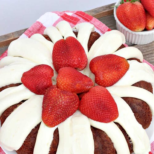 Best Strawberry Bundt Cake | Can't Stay Out of the Kitchen | This is a better version that #NothingBundtCakes that will wow your friends and knock your socks off! This delectable #cake is rich, decadent & heavenly. It's made with #Strawberry cake mix, strawberry jello & #StrawberryPieFilling. The #CreamCheese icing is luscious & irresistible! #StrawberryBundtCake #dessert #StrawberryDessert #holiday #HolidayDessert #BestStrawberryBundtCake