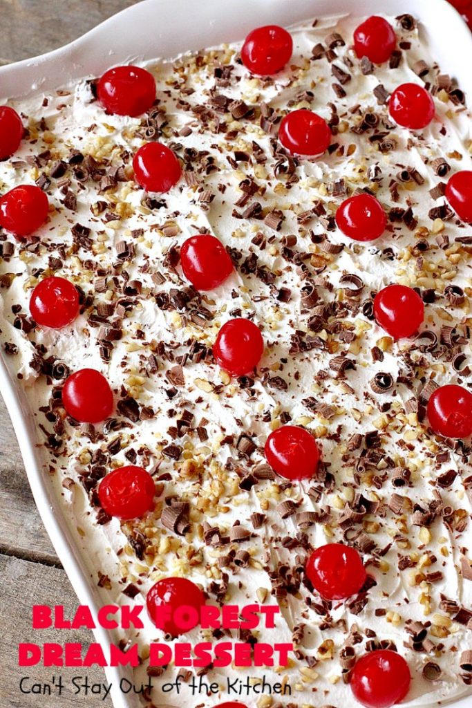 Black Forest Dream Dessert | Can't Stay Out of the Kitchen | this spectacular #dessert has a crust layer with #pecans & #coconut. It also has #cheesecake layer, a #cherrypiefilling layer, a vanilla pudding layer with melted #chocolatechips added, & a top layer with #CoolWhip, #maraschinocherries, #chocolate curls & chopped #pecans. Absolutely divine! #BlackForestDessert #CherryDessert #ChocolateDessert #ValentinesDay #ValentinesDayDessert #ChristmasDessert #CheesecakeDessert