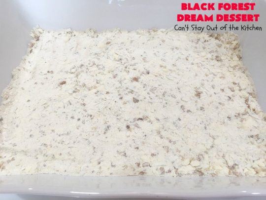 Black Forest Dream Dessert | Can't Stay Out of the Kitchen | this spectacular #dessert has a crust layer with #pecans & #coconut. It also has #cheesecake layer, a #cherrypiefilling layer, a vanilla pudding layer with melted #chocolatechips added, & a top layer with #CoolWhip, #maraschinocherries, #chocolate curls & chopped #pecans. Absolutely divine! #BlackForestDessert #CherryDessert #ChocolateDessert #ValentinesDay #ValentinesDayDessert #ChristmasDessert #CheesecakeDessert