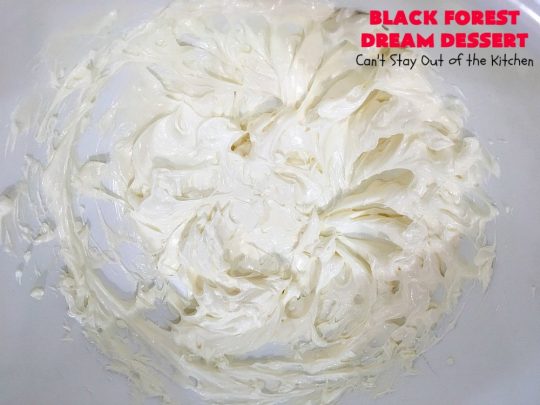 Black Forest Dream Dessert | Can't Stay Out of the Kitchen | this spectacular #dessert has a crust layer with #pecans & #coconut. It also has #cheesecake layer, a #cherrypiefilling layer, a vanilla pudding layer with melted #chocolatechips added, & a top layer with #CoolWhip, #maraschinocherries, #chocolate curls & chopped #pecans. Absolutely divine! #BlackForestDessert #CherryDessert #ChocolateDessert #ValentinesDay #ValentinesDayDessert #ChristmasDessert #CheesecakeDessert