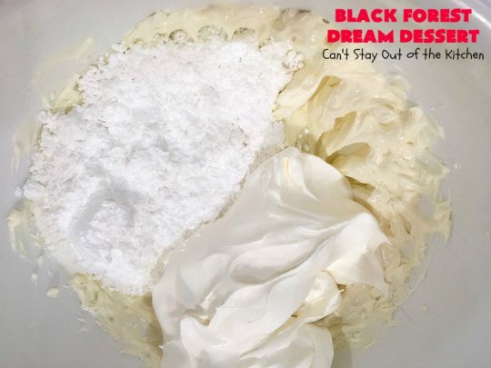 Black Forest Dream Dessert | Can't Stay Out of the Kitchen | this spectacular #dessert has a crust layer with #pecans & #coconut. It also has #cheesecake layer, a #cherrypiefilling layer, a vanilla pudding layer with melted #chocolatechips added, & a top layer with #CoolWhip, #maraschinocherries, #chocolate curls & chopped #pecans. Absolutely divine! #BlackForestDessert #CherryDessert #ChocolateDessert #ValentinesDay #ValentinesDayDessert #ChristmasDessert #CheesecakeDessert
