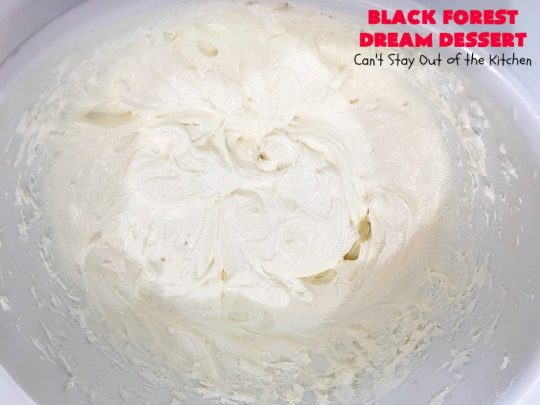 Black Forest Dream Dessert | Can't Stay Out of the Kitchen | this spectacular #dessert has a crust layer with #pecans & #coconut. It also has #cheesecake layer, a #cherrypiefilling layer, a vanilla pudding layer with melted #chocolatechips added, & a top layer with #CoolWhip, #maraschinocherries, #chocolate curls & chopped #pecans. Absolutely divine! #BlackForestDessert #CherryDessert #ChocolateDessert #ValentinesDay #ValentinesDayDessert #ChristmasDessert #CheesecakeDessert