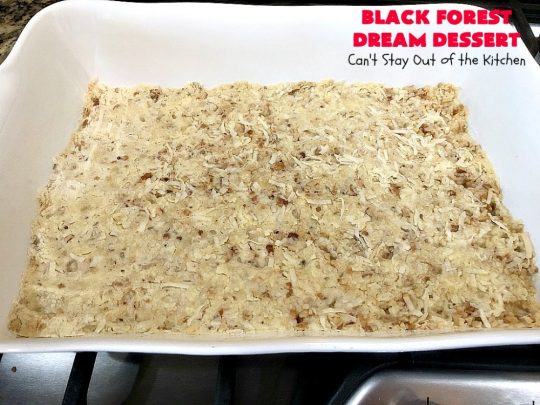 Black Forest Dream Dessert | Can't Stay Out of the Kitchen | this spectacular #dessert has a crust layer with #pecans & #coconut. It also has #cheesecake layer, a #cherrypiefilling layer, a vanilla pudding layer with melted #chocolatechips added, & a top layer with #CoolWhip, #maraschinocherries, #chocolate curls & chopped #pecans. Absolutely divine! #BlackForestDessert #CherryDessert #ChocolateDessert #ValentinesDay #ValentinesDayDessert #ChristmasDessert #CheesecakeDessert