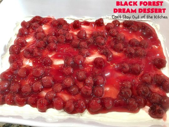 Black Forest Dream Dessert | Can't Stay Out of the Kitchen | this spectacular #dessert has a crust layer with #pecans & #coconut. It also has #cheesecake layer, a #cherrypiefilling layer, a vanilla pudding layer with melted #chocolatechips added, & a top layer with #CoolWhip, #maraschinocherries, #chocolate curls & chopped #pecans. Absolutely divine! #BlackForestDessert #CherryDessert #ChocolateDessert #ValentinesDay #ValentinesDayDessert #ChristmasDessert #CheesecakeDessert