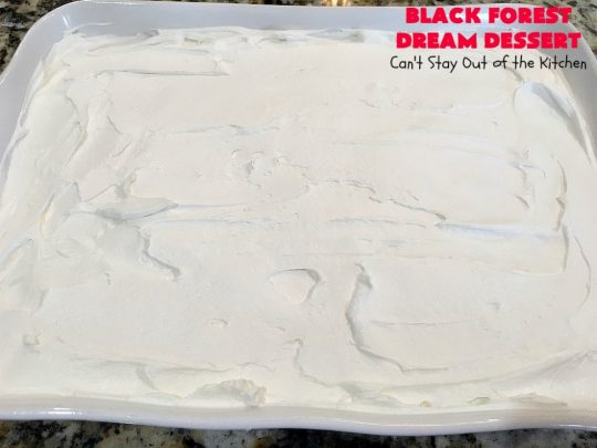 Black Forest Dream Dessert | Can't Stay Out of the Kitchen | this spectacular #dessert has a crust layer with #pecans & #coconut. It also has #cheesecake layer, a #cherrypiefilling layer, a vanilla pudding layer with melted #chocolatechips added, & a top layer with #CoolWhip, #maraschinocherries, #chocolate curls & chopped #pecans. Absolutely divine! #BlackForestDessert #CherryDessert #ChocolateDessert #ValentinesDay #ValentinesDayDessert #ChristmasDessert #CheesecakeDessert