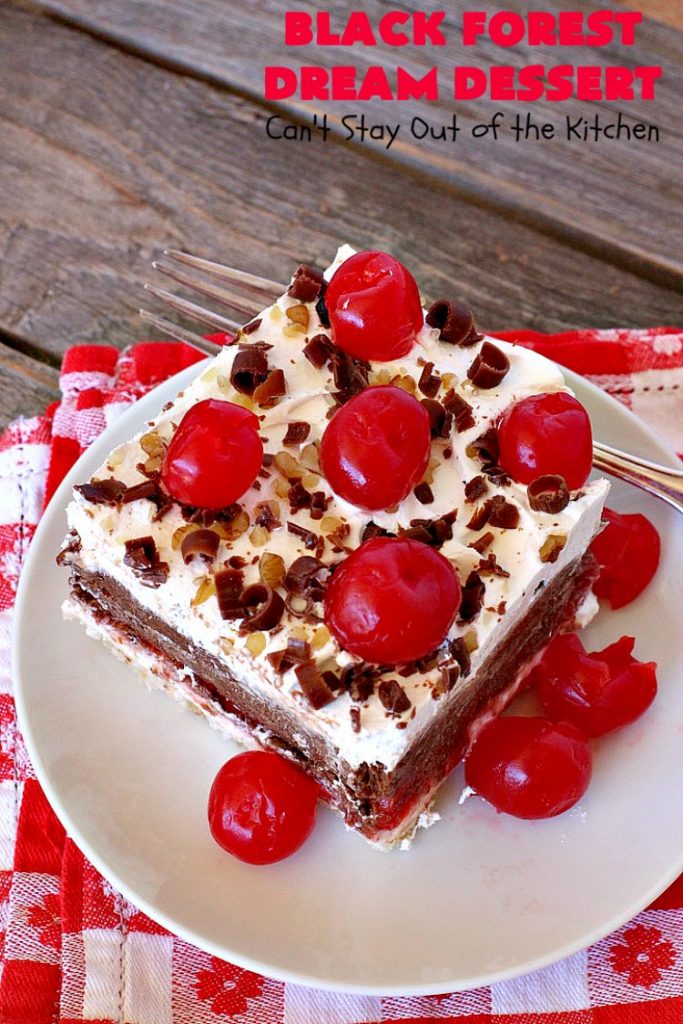 Black Forest Dream Dessert | Can't Stay Out of the Kitchen | this spectacular #dessert has a crust layer with #pecans & #coconut. It also has #cheesecake layer, a #cherrypiefilling layer, a vanilla pudding layer with melted #chocolatechips added, & a top layer with #CoolWhip, #maraschinocherries, #chocolate curls & chopped #pecans. Absolutely divine! #BlackForestDessert #CherryDessert #ChocolateDessert #ValentinesDay #ValentinesDayDessert #ChristmasDessert #CheesecakeDessert