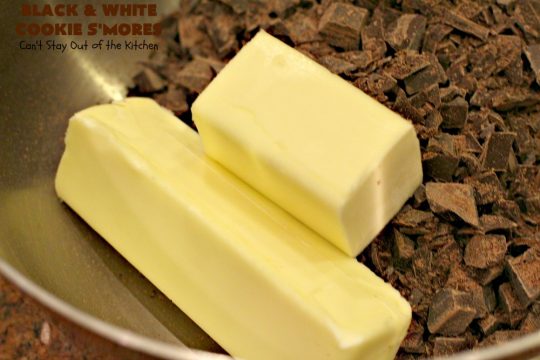 Black and White Cookie S'Mores | Can't Stay Out of the Kitchen | this fantastic #PaulaDeen #recipe includes #chocolate bars, #GrahamCrackers and #WhiteChocolateChips in the #cookie. Each one is put together with #MarshmallowCreme. These are the ultimate in #SmoresCookie! Great for #holiday #baking & #ChristmasCookieExchanges too. #Smores #dessert #SmoresDessert #BlackAndWhiteCookieSMores
