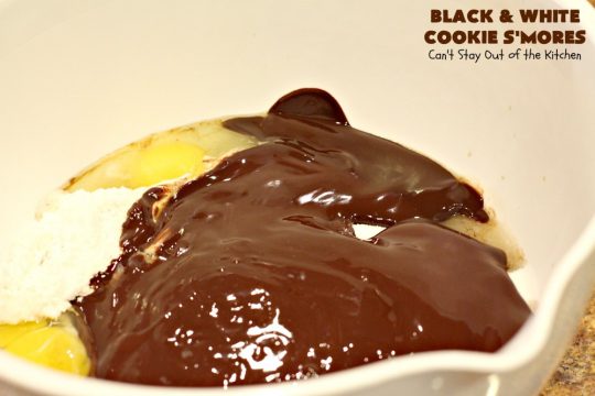 Black and White Cookie S'Mores | Can't Stay Out of the Kitchen | this fantastic #PaulaDeen #recipe includes #chocolate bars, #GrahamCrackers and #WhiteChocolateChips in the #cookie. Each one is put together with #MarshmallowCreme. These are the ultimate in #SmoresCookie! Great for #holiday #baking & #ChristmasCookieExchanges too. #Smores #dessert #SmoresDessert #BlackAndWhiteCookieSMores