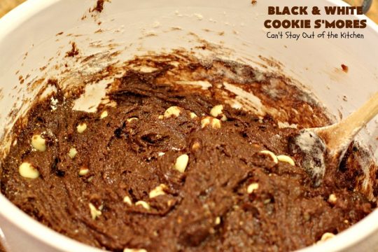 Black and White Cookie S'Mores | Can't Stay Out of the Kitchen | this fantastic #PaulaDeen #recipe includes #chocolate bars, #GrahamCrackers and #WhiteChocolateChips in the #cookie. Each one is put together with #MarshmallowCreme. These are the ultimate in #SmoresCookie! Great for #holiday #baking & #ChristmasCookieExchanges too. #Smores #dessert #SmoresDessert #BlackAndWhiteCookieSMores