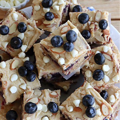 Blueberry Almond Blondies | Can't Stay Out of the Kitchen | these rich, decadent, drool-worthy #blondies will have you swooning from the first bite. They're filled with #blueberries, #almonds, #VanillaChips & made with #BrownedButter in the batter & the icing. Great for #tailgating parties, #BackyardBarbecue, or potlucks. Be prepared: these #cookies are addictive. You'll want more than one! #dessert #BlueberryAlmondBlondies