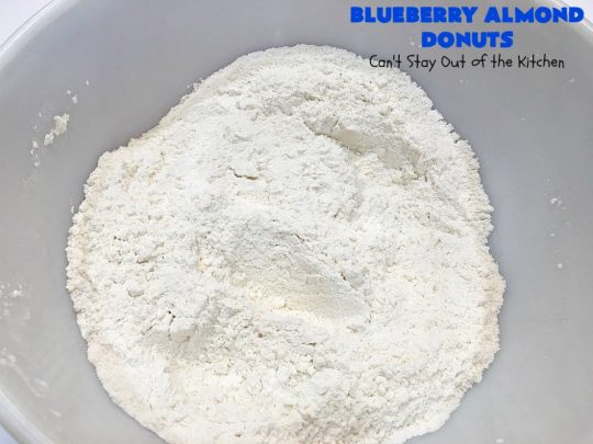 Blueberry Almond Donuts | Can't Stay Out of the Kitchen | these fabulous #blueberry #donuts include #almond extract in both the donut and the icing. They are outrageously delicious! I've made these 3 times & everyone always loves them. #blueberries #BlueberryDonuts #breakfast #Holiday #HolidayBreakfast 