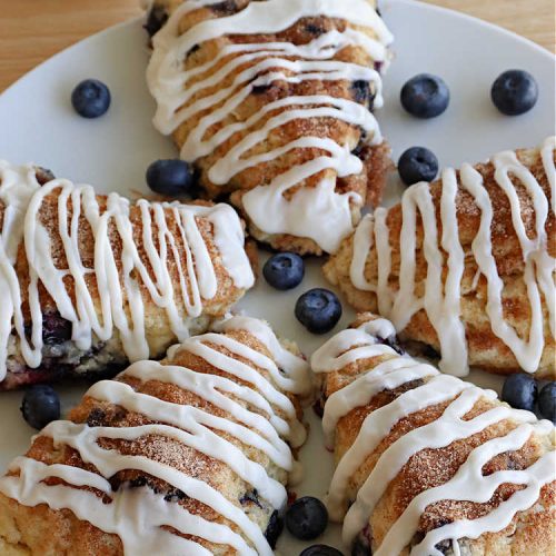 Blueberry Cinnamon Scones | Can't Stay Out of the Kitchen | these #scones are absolutely delightful.. They have a soft, almost bread-like texture & they're filled with #blueberries, baked with a #CinnamonSugar topping & iced with a powdered sugar glaze. They're fantastic for weekend, company or a #holiday #breakfast. Every bite will have you swooning! #BlueberryCinnamonScones