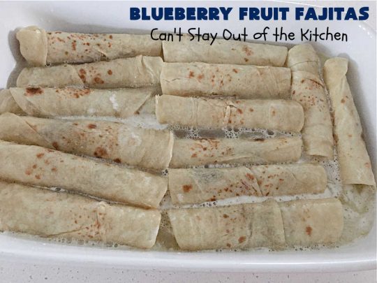Blueberry Fruit Fajitas | Can't Stay Out of the Kitchen | These lovely #FruitFajitas use #BlueberryPieFilling and are wrapped in #tortillas. Then they're saturated in a lovely syrup before baking. This delightful #recipe is great for #dessert but since they're like #crepes we enjoy them for #breakfast too. #HolidayDessert #BlueberryDessert #CincoDeMayo #Blueberries #BlueberryFruitFajitas
