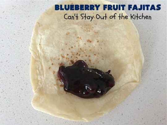 Blueberry Fruit Fajitas | Can't Stay Out of the Kitchen | These lovely #FruitFajitas use #BlueberryPieFilling and are wrapped in #tortillas. Then they're saturated in a lovely syrup before baking. This delightful #recipe is great for #dessert but since they're like #crepes we enjoy them for #breakfast too. #HolidayDessert #BlueberryDessert #CincoDeMayo #Blueberries #BlueberryFruitFajitas
