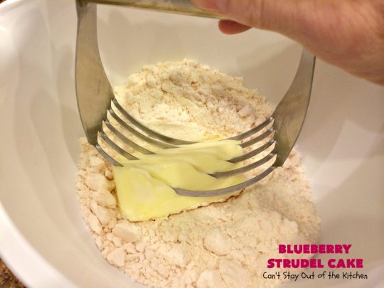 Blueberry Strudel Cake | Can't Stay Out of the Kitchen | this spectacular #cake is divine! The crust layer is made with a boxed #cakemix. It's topped with #Blueberrypiefilling, a streusel layer & glazed with an #almond flavored icing. Terrific #dessert for #Easter or #MothersDay. #BlueberryStrudelCake #BlueberryCake #BlueberryDessert #Coffeecake #breakfast #HolidayBreakfast #BlueberryCoffeecake
