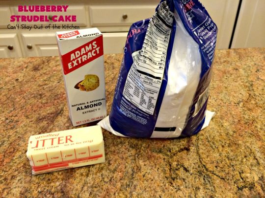 Blueberry Strudel Cake | Can't Stay Out of the Kitchen | this spectacular #cake is divine! The crust layer is made with a boxed #cakemix. It's topped with #Blueberrypiefilling, a streusel layer & glazed with an #almond flavored icing. Terrific #dessert for #Easter or #MothersDay. #BlueberryStrudelCake #BlueberryCake #BlueberryDessert #Coffeecake #breakfast #HolidayBreakfast #BlueberryCoffeecake