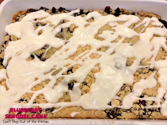 Blueberry Strudel Cake | Can't Stay Out of the Kitchen | this spectacular #cake is divine! The crust layer is made with a boxed #cakemix. It's topped with #Blueberrypiefilling, a streusel layer & glazed with an #almond flavored icing. Terrific #dessert for #Easter or #MothersDay. #BlueberryStrudelCake #BlueberryCake #BlueberryDessert #Coffeecake #breakfast #HolidayBreakfast #BlueberryCoffeecake