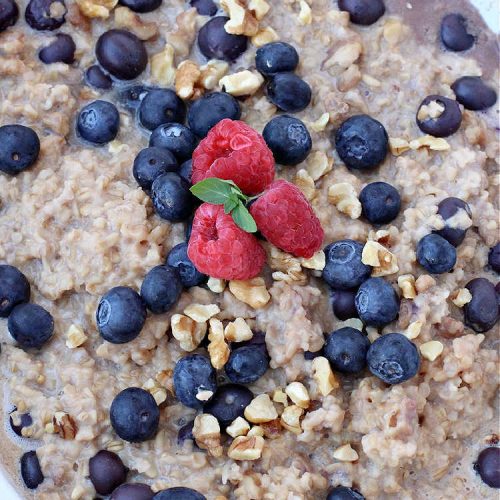 Blueberry Walnut Overnight Oatmeal | Can't Stay Out of the Kitchen | this lovely homemade #oatmeal #recipe is terrific for a #holiday or weekend #breakfast. Plus it makes 12 servings so it's great to reheat for breakfast on the go. If you have a programmable #crockpot it doesn't get any easier than this. #blueberries #walnuts #vegan #OvernightOatmeal #GlutenFree #SlowCooker #BlueberryWalnutOvernightOatmeal