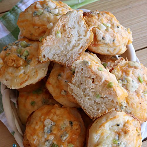 Buffalo Chicken Pizza Cups | Can't Stay Out of the Kitchen | these scrumptious miniature #pizzas include #BuffaloChickenDip in the centers & they're topped with 3 #cheeses including #mozzarella, #TacoCheese & #BlueCheese crumbles. Sensational #appetizer for #holidays, #tailgating parties, potlucks or the #SuperBowl. #BuffaloChicken #chicken #BuffaloChickenPizzaCups