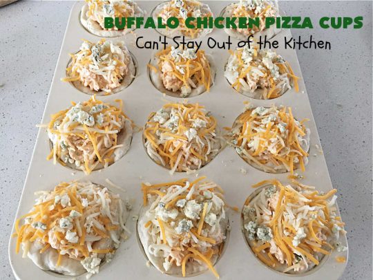 Buffalo Chicken Pizza Cups | Can't Stay Out of the Kitchen | these scrumptious miniature #pizzas include #BuffaloChickenDip in the centers & they're topped with 3 #cheeses including #mozzarella, #TacoCheese & #BlueCheese crumbles. Sensational #appetizer for #holidays, #tailgating parties, potlucks or the #SuperBowl. #BuffaloChicken #chicken #BuffaloChickenPizzaCups